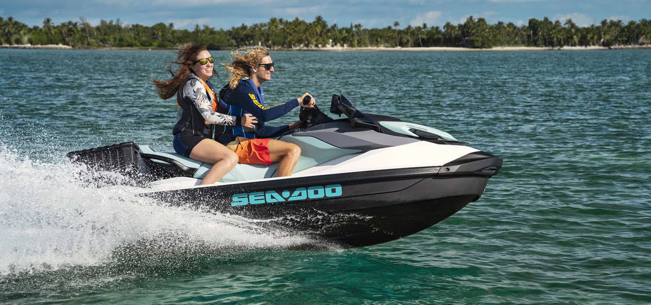 Image of two people riding a Sea-Doo PWC